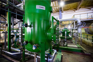 green chemical vat inside a facility
